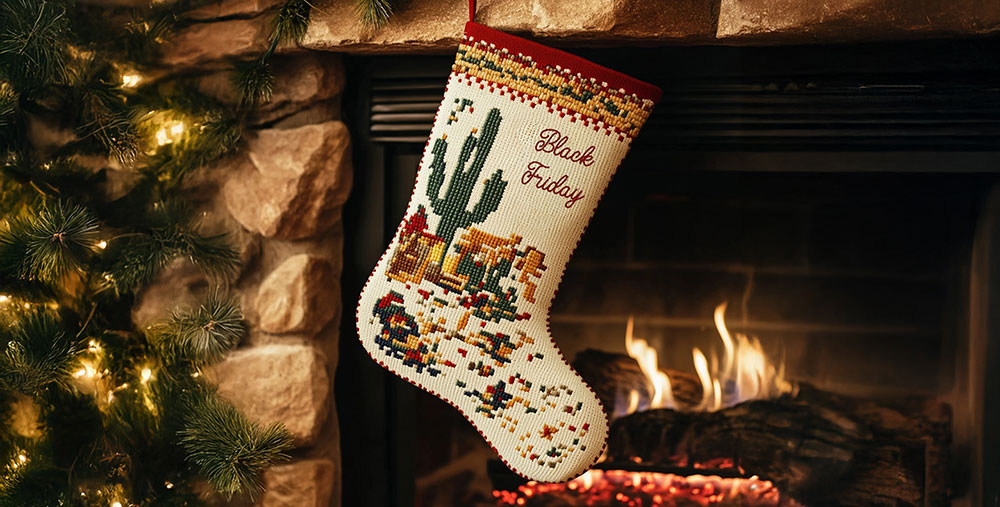 A stocking with the words Black Friday embroidered on it, hanging in front of a fireplace.